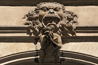 Lion relief and sculpture above the entrance of the Baumeisterhaus of 1596