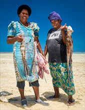 Two local women returning with their catch of octopus