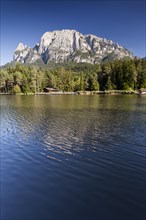 Lago di Fie lake in front of Sciliar Mountain