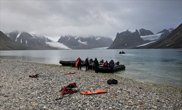 Tourists in inflatable boats