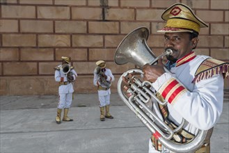 Musicians of a brass band wearing uniforms