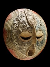 Traditional Ghanaian wooden and metal tribal mask