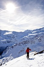 Cross-country skier ascending Kalfanwand Mountain in the Martell Valley