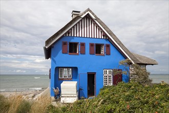 House with thatched roof and sea view
