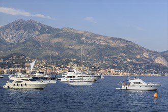 Motor yachts and sailboats moored off the coast of Roquebrune-Cap-Martin