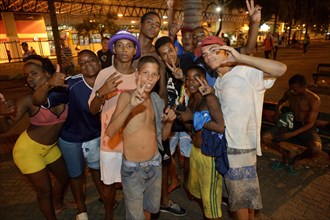 Group of street children at night in the square in front of the Central do Brasil railway station in the centre of Rio de Janeiro