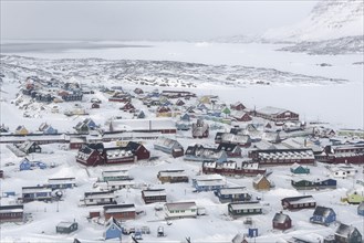 View in winter to the colourful houses of Qeqertarsuaq