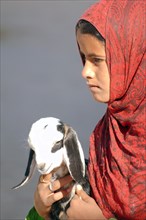 A young Bedouin girl with goat