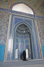 Woman praying in the Masjed-i Jame Mosque or Friday Mosque