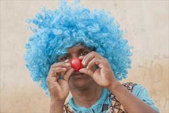 Member of a carnival club in the slums of Ribeira Bote