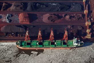 Ore being loaded onto a freight ship