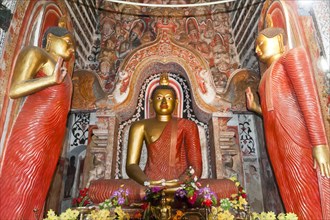 Large brightly painted golden Buddha figure
