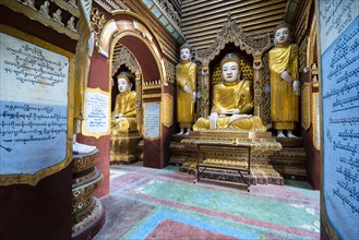 Seated and standing Buddha statues