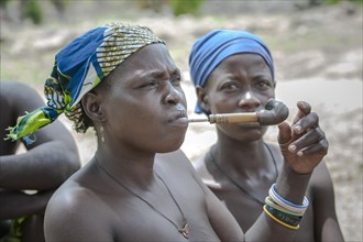 A woman from the Koma people smoking a pipe