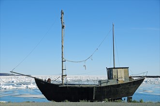 Old ship on the shore of the Beaufort Sea