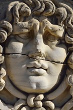 Antique Medusa or Gorgon head at the Apollon temple