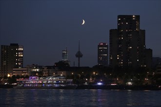 Cologne on the Rhine River with a crescent moon