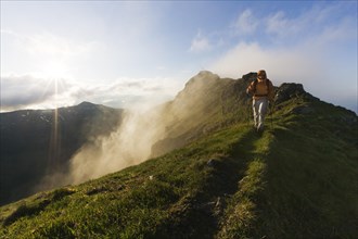 Hiker on the summit of Mt Grosser Galtenberg in the evening light