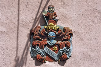 Coat of arms plaque of the Hoffmann family on a facade