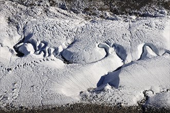 Meandering meltwater stream in glacial ice