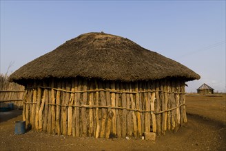 Round hut made of tree trunks