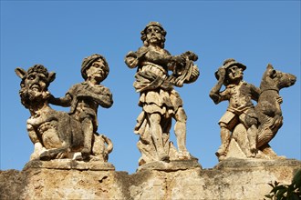 Baroque statues on the wall of Villa Palagonia