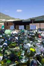 Glass bottles at a collecting point for recycling