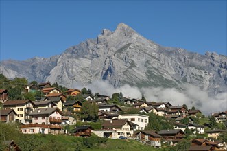 Valaisian village of Sornard in front of the summit of Haut de Cry Mountain