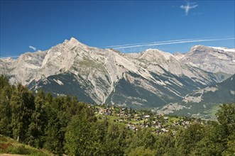 View from Haute-Nendaz over the Rhone Valley towards the summit of Haut de Cry Mountain in the Bernese Alps