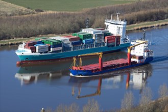 Feeder and a specialised vessel on the Kiel Canal or Nord-Ostsee-Kanal