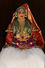 Fully made-up and costumed Kathakali dancer during a performance