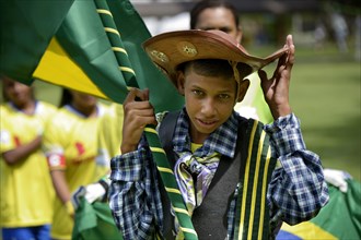 Flag bearer of the Brazilian team wearing the traditional costume of the peasants of the Brazilian Northeast