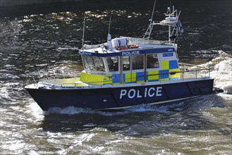 Police boat on patrol on the River Thames
