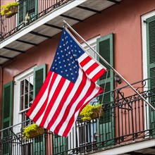American flag outside a historic house in the French Quarter