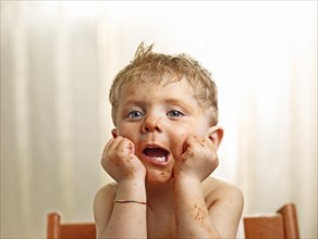 Toddler with a sauce-smeared face