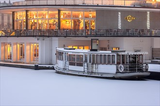 Alsterpavillon with the Alster steamer St. George on this frozen Alster Lake in the morning