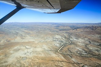 View from a small plane over the dry riverbed of Oanob River