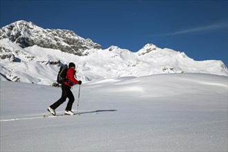 Ski tourer in the high valley above Lech am Arlberg
