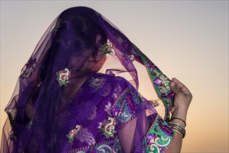 Woman wearing a purple sari