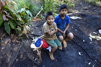 Two indigenous boys in the village of the Xavantes people