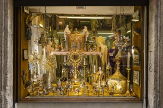 Shop window with devotional objects and goods for priests