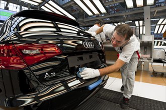 Man working on the production line of the Audi A3 at the Audi plant