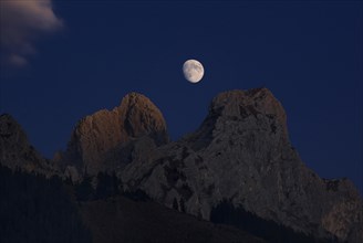 Waxing moon between Roten Fluh und Gimpel mountains in Tannheim Valley