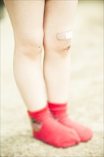 Girl's leg with red socks