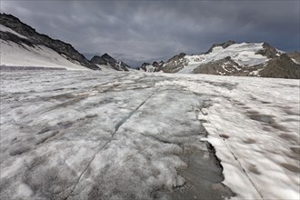 Melting dirty glacier forming crevasses