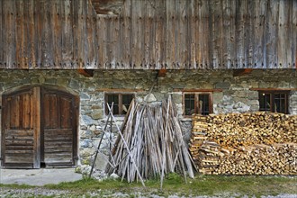 Hay drying poles and a woodpile in Markus Wasmeier Farm and Winter Sports Museum