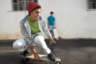Teenager riding a longboard