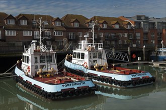 Two Portsmouth tug boats moored in Portsmouth Harbour