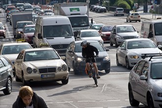 Cyclists and cars in traffic