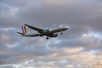 Germanwings airplane during the landing approach at Cologne-Bonn Airport at dusk